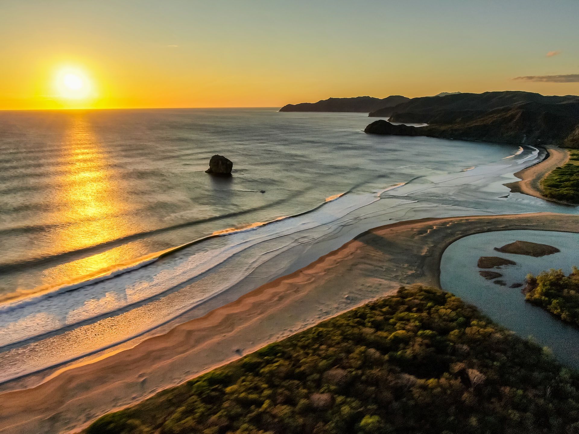 Beautiful aerial view of a sunset in Naranjo Beach - Witch Rock Costa Rica © Shutterstock