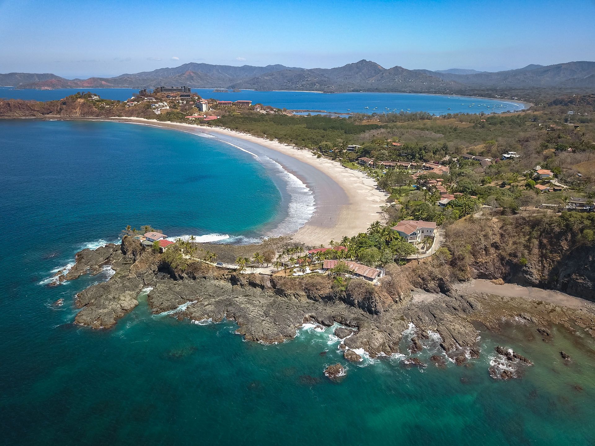 Playa Flamingo, Guanacaste, Costa Rica - Aerial Drone shot of Flamingo Beach South Ridge with panoramic View over Playa Potrero © Shutterstock