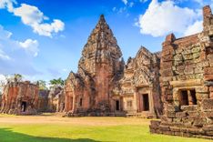 Phimai historical park on blue sky background, An ancient stone castle, World heritage in north east of Thailand © Paahboobkk/Shutterstock