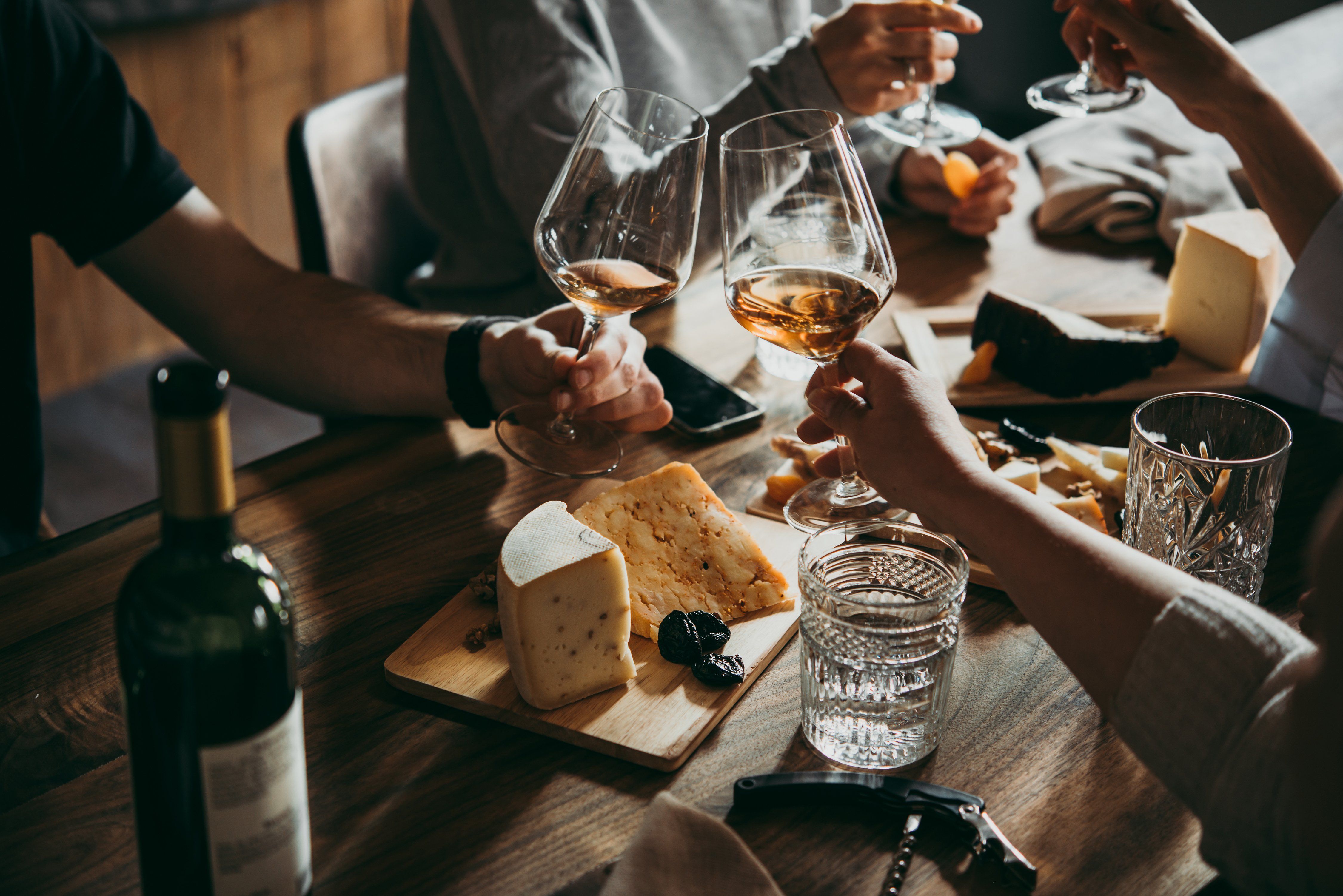 wine-cheese-party-restaurant-bar-friends-shutterstock_1081684592